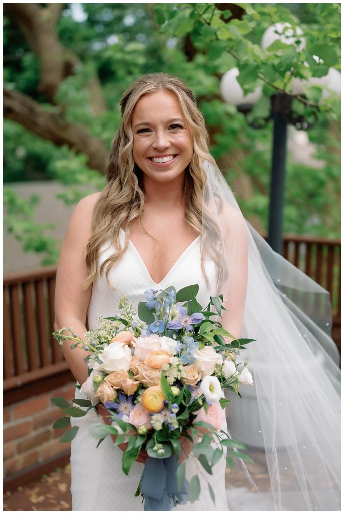 picture of bride holding her colorful bouquet 