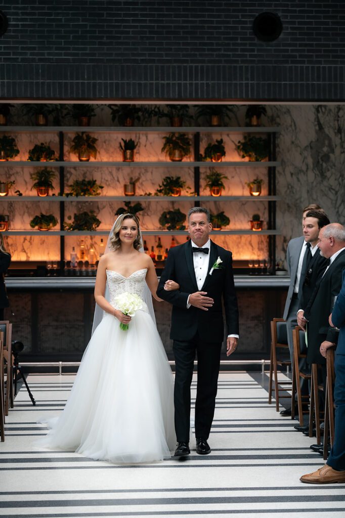 Bride walking down the aisle with her father