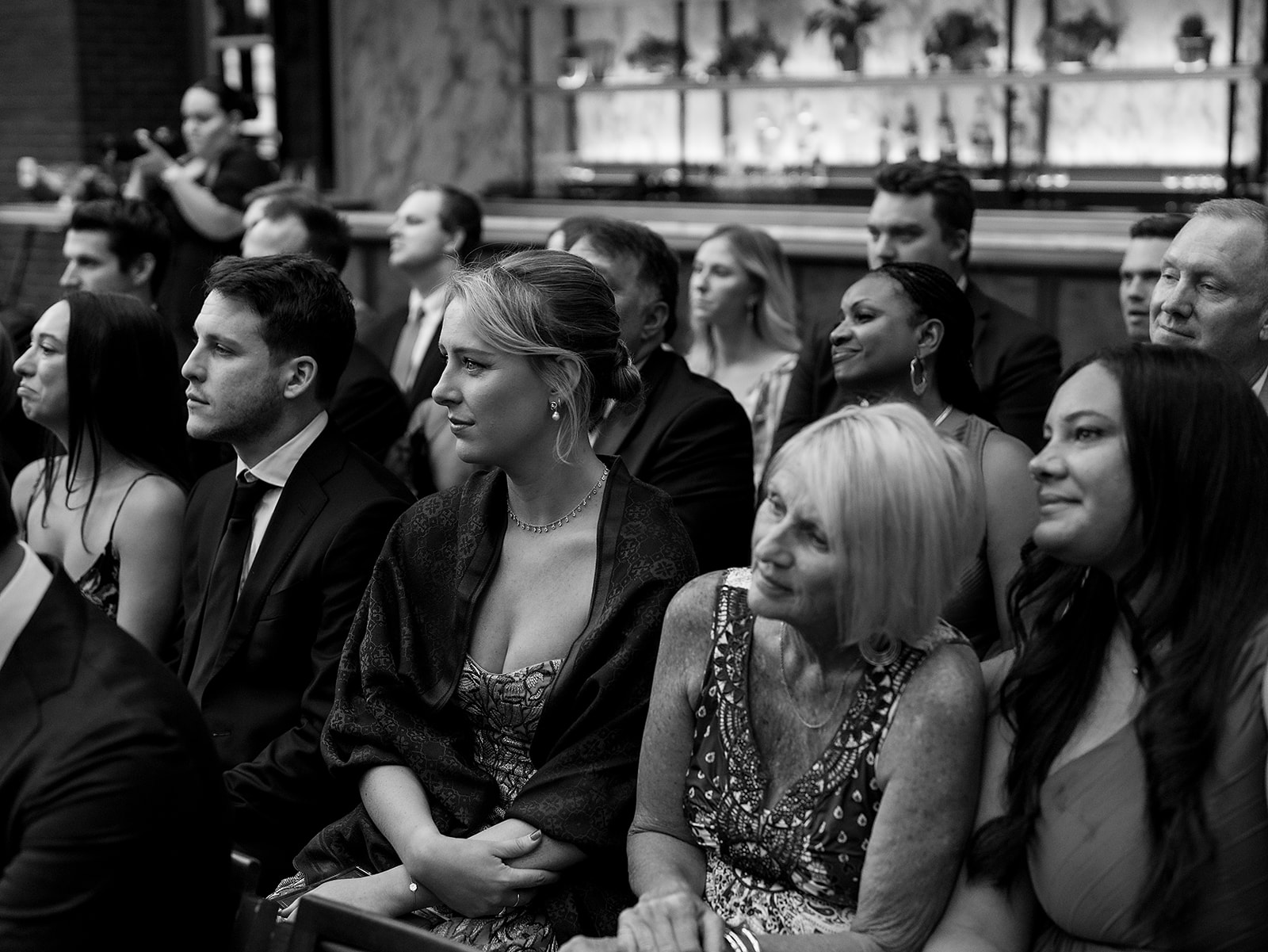 Guests watching the wedding ceremony