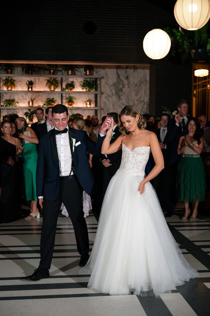 Bride and grooms first dance during their Shinola Hotel wedding reception