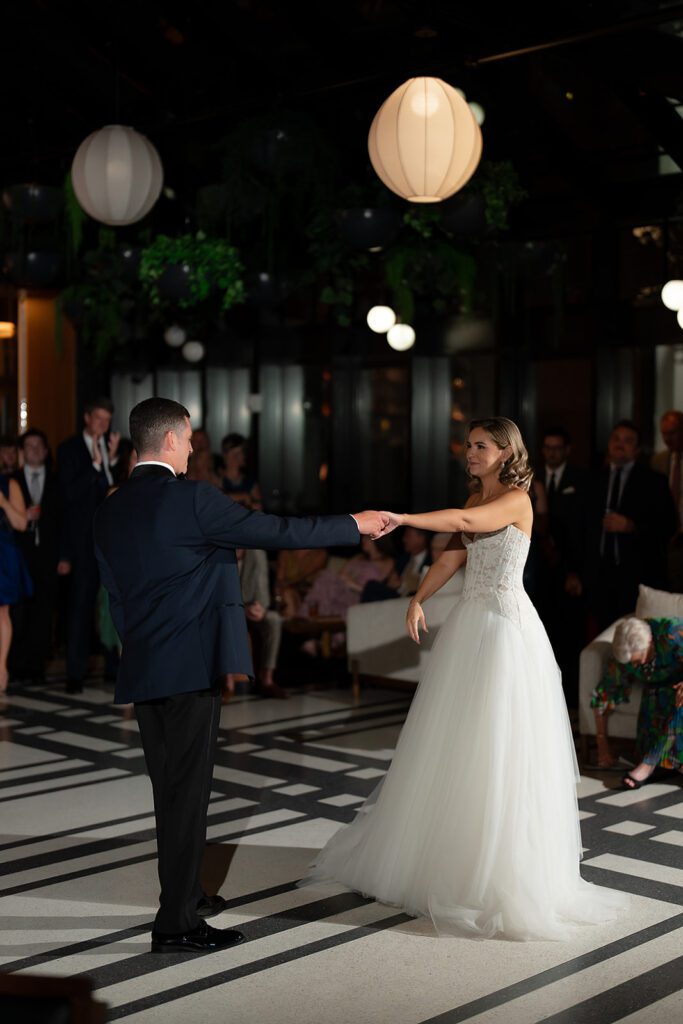 Bride and grooms first dance during their Shinola Hotel wedding reception