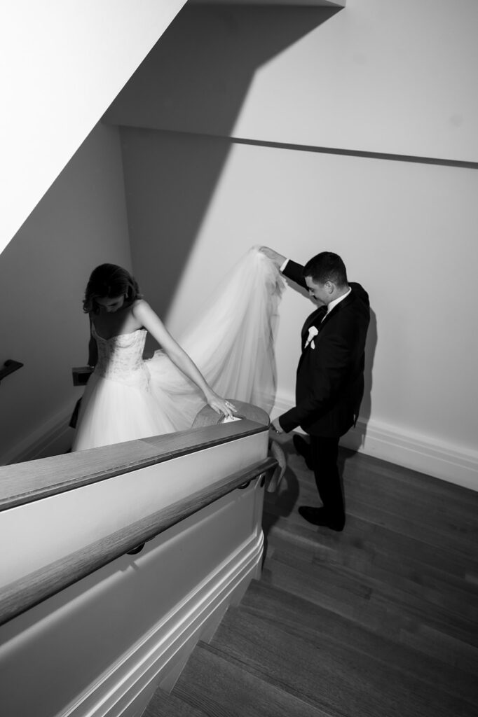 Bride and groom sneaking away for more wedding portraits