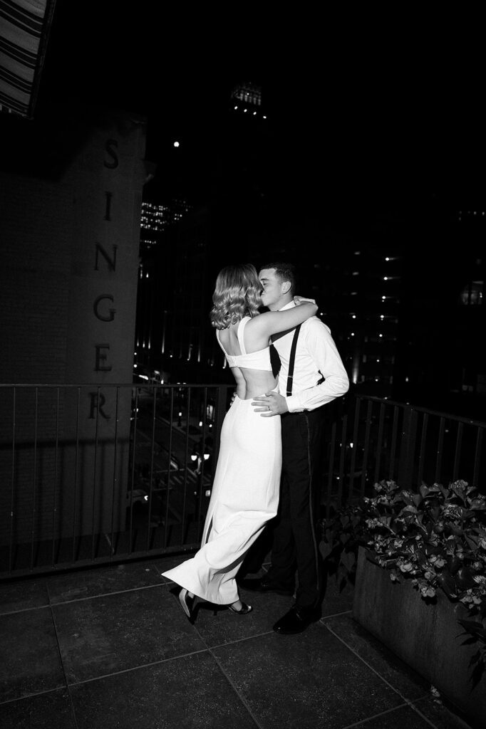 Bride and grooms nighttime flash rooftop Shinola Hotel wedding portraits