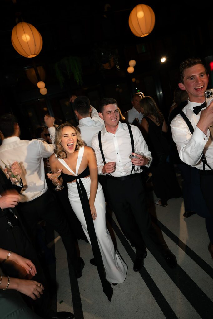 Bride and groom laughing during their wedding reception
