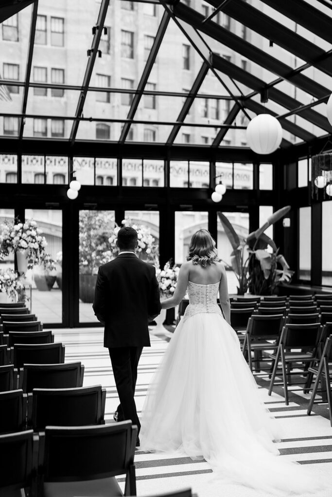 Bride and groom admiring their Shinola Hotel wedding ceremony space in The Birdy Room