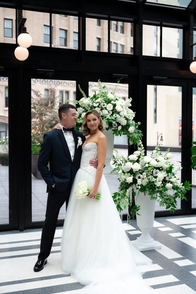 Bride and groom admiring their Shinola Hotel wedding ceremony space in The Birdy Room