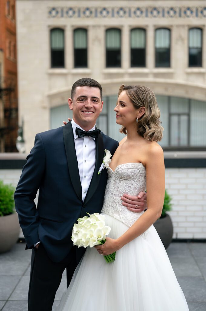 Bride and grooms rooftop Shinola Hotel portraits in Detroit, Michigan