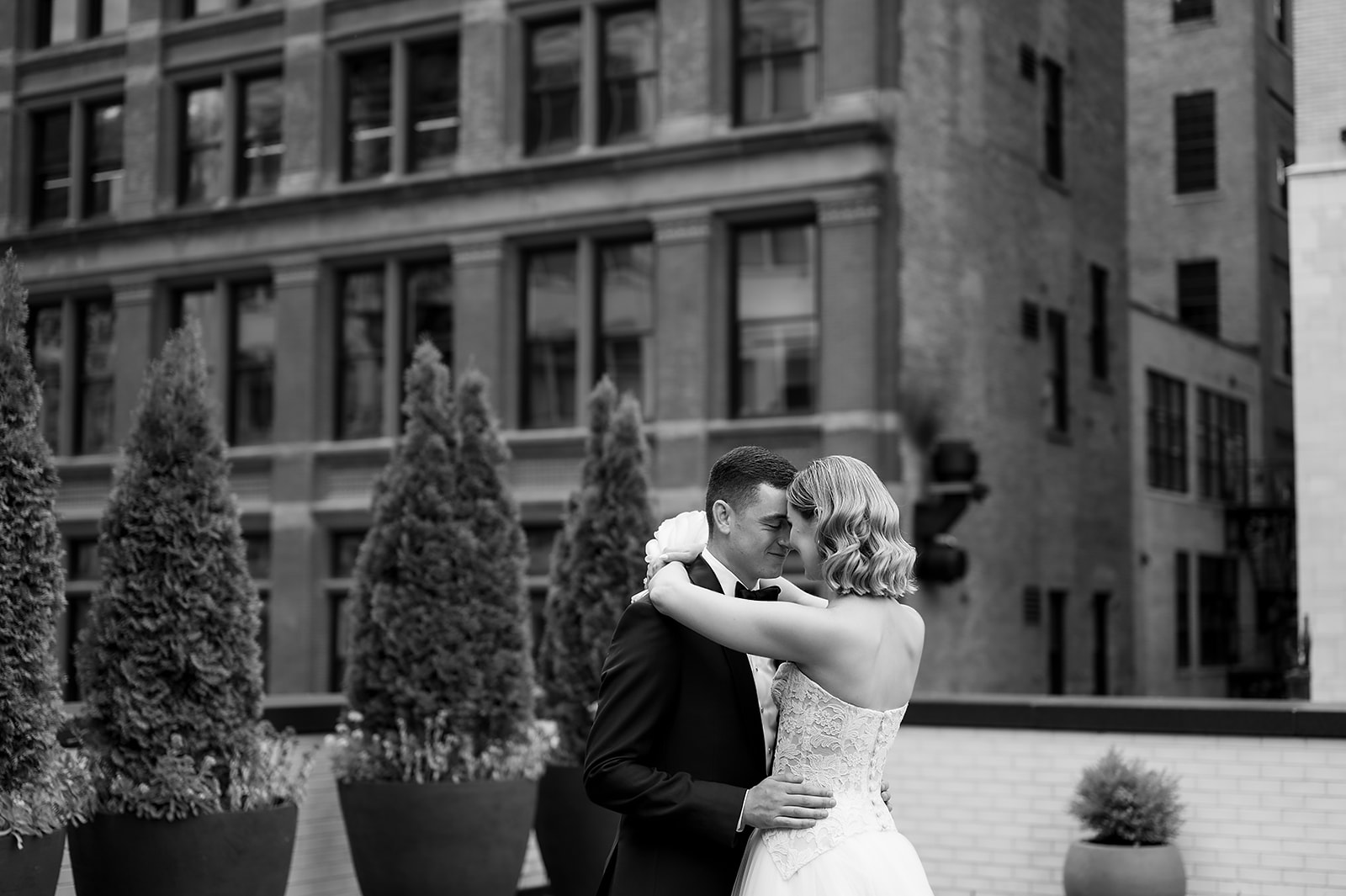 Bride and grooms rooftop Shinola Hotel wedding portraits in Detroit, Michigan
