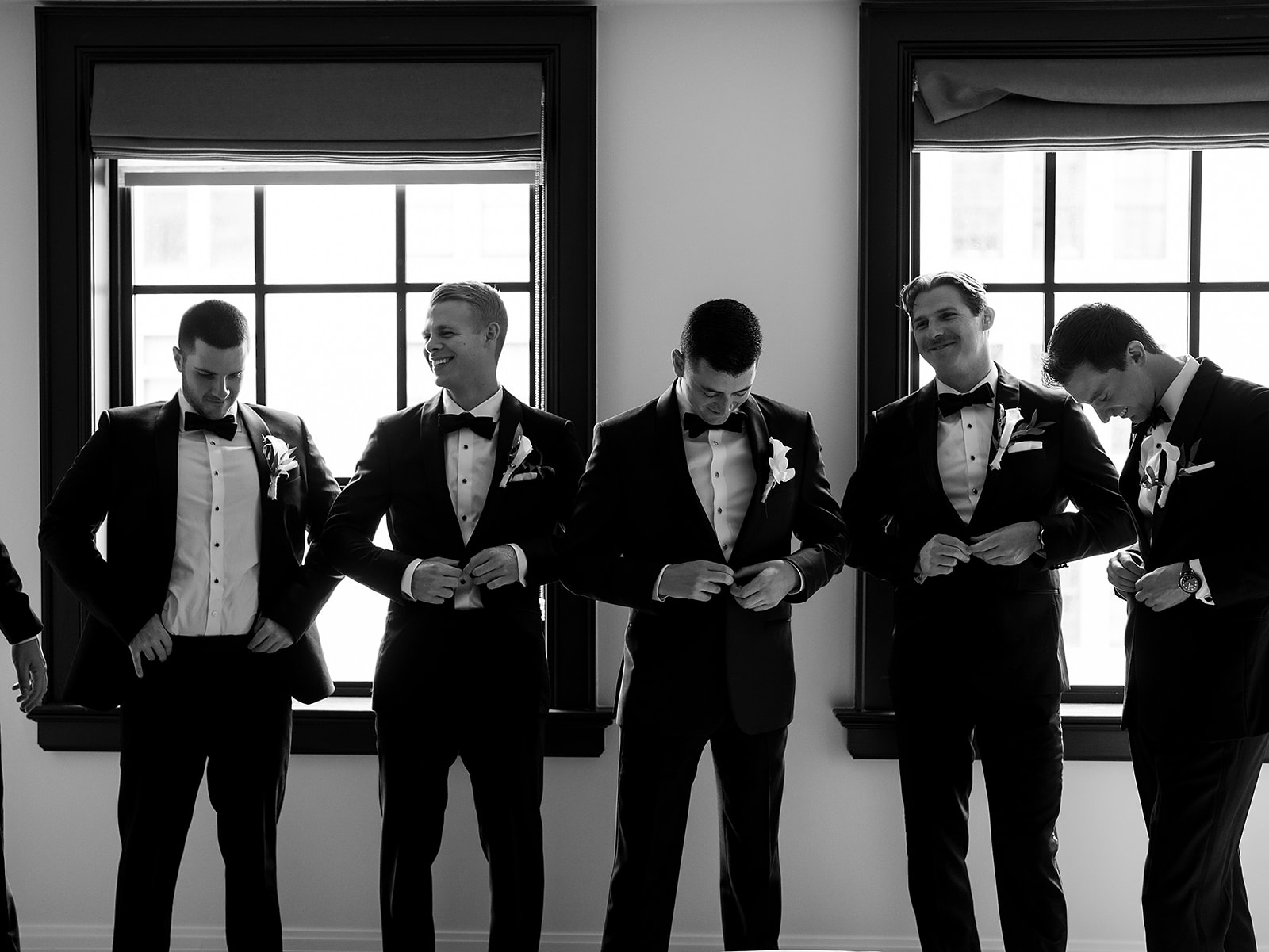 Indoor groom and groomsmen portraits from a Shinola Hotel wedding in Detroit, Michigan