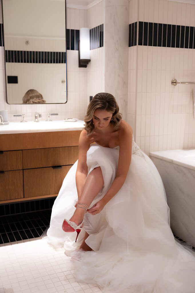Bride putting on her heels