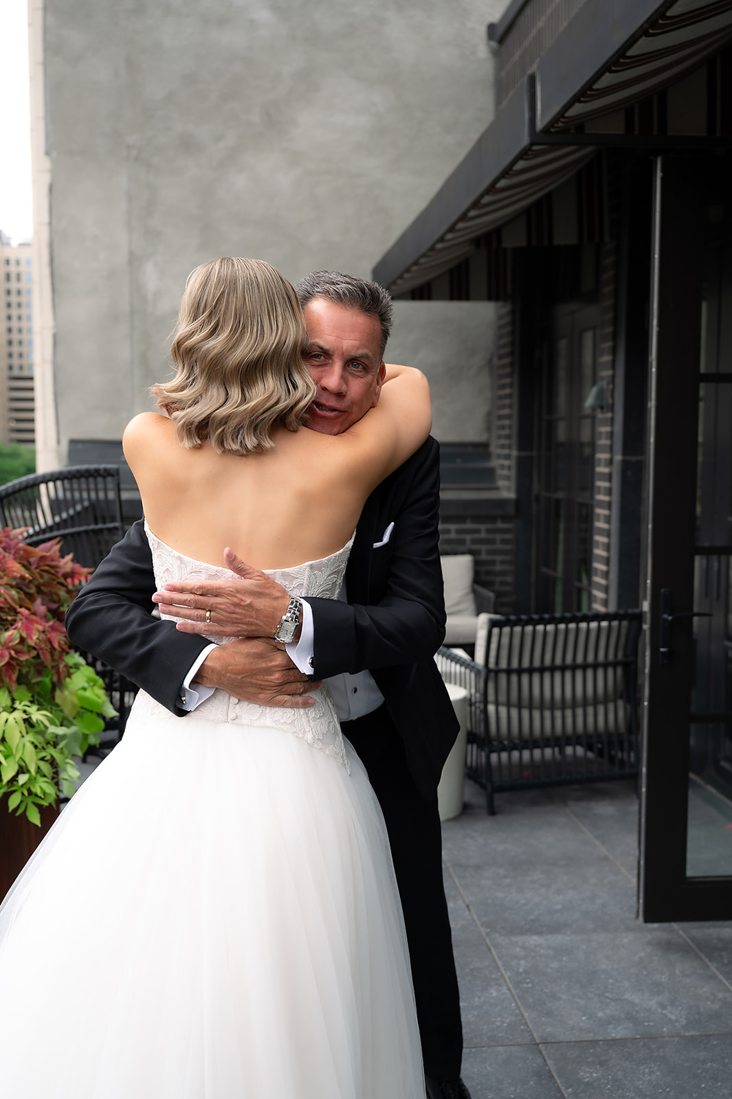 Bride hugging her father during her first look with him