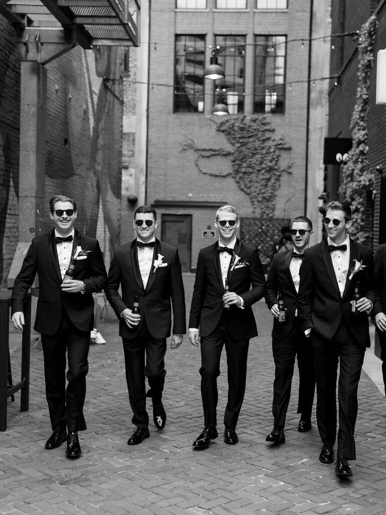 Outdoor groom and groomsmen portraits from a classic Shinola Hotel wedding in Detroit, Michigan