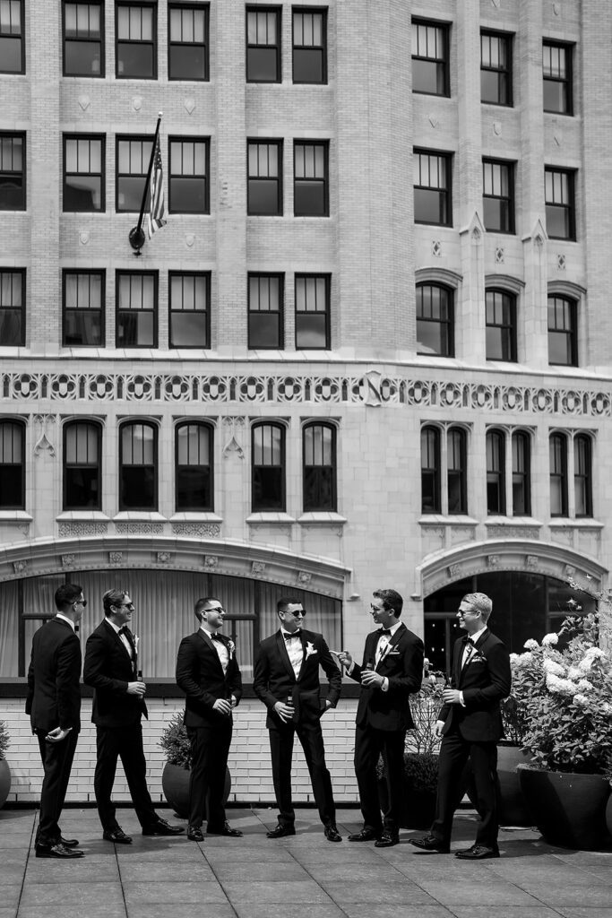Rooftop groom and groomsmen portraits from a classic Shinola Hotel wedding in Detroit, Michigan