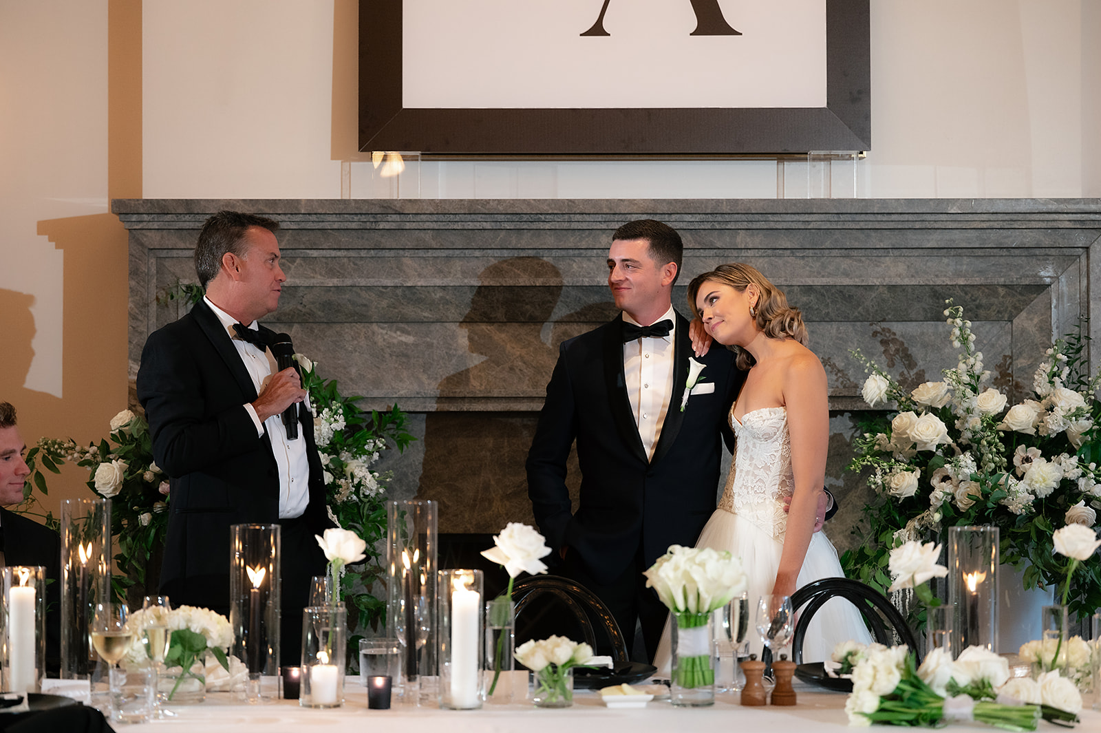 Bride and groom listening to wedding speeches