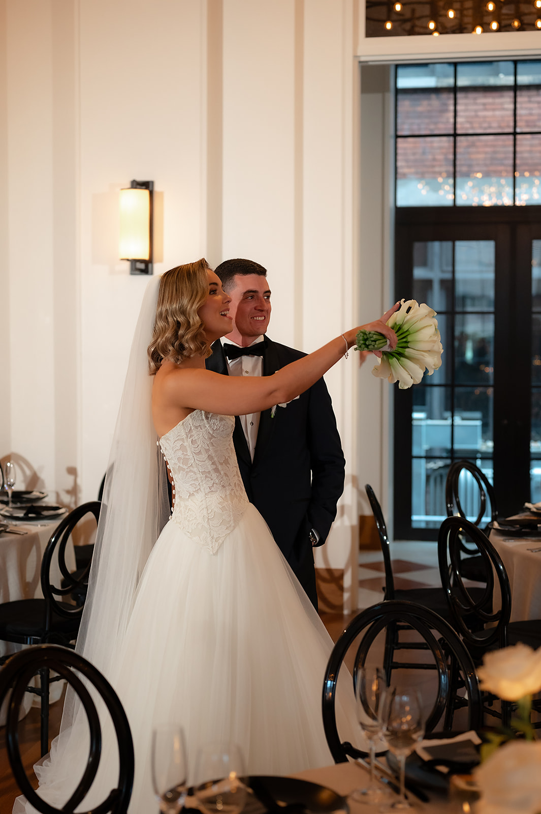Bride and groom admiring their Shinola Hotel wedding reception space in Bixby Hall