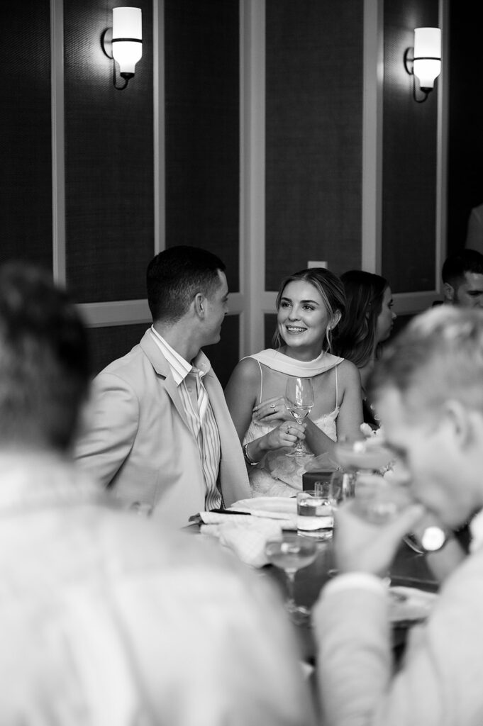 Bride and groom talking during their welcome wedding party