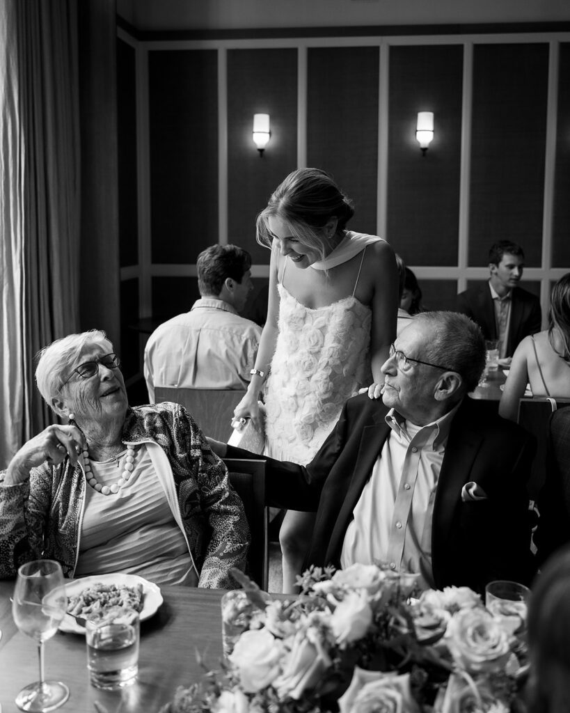 Bride mingling with guests during their welcome wedding party