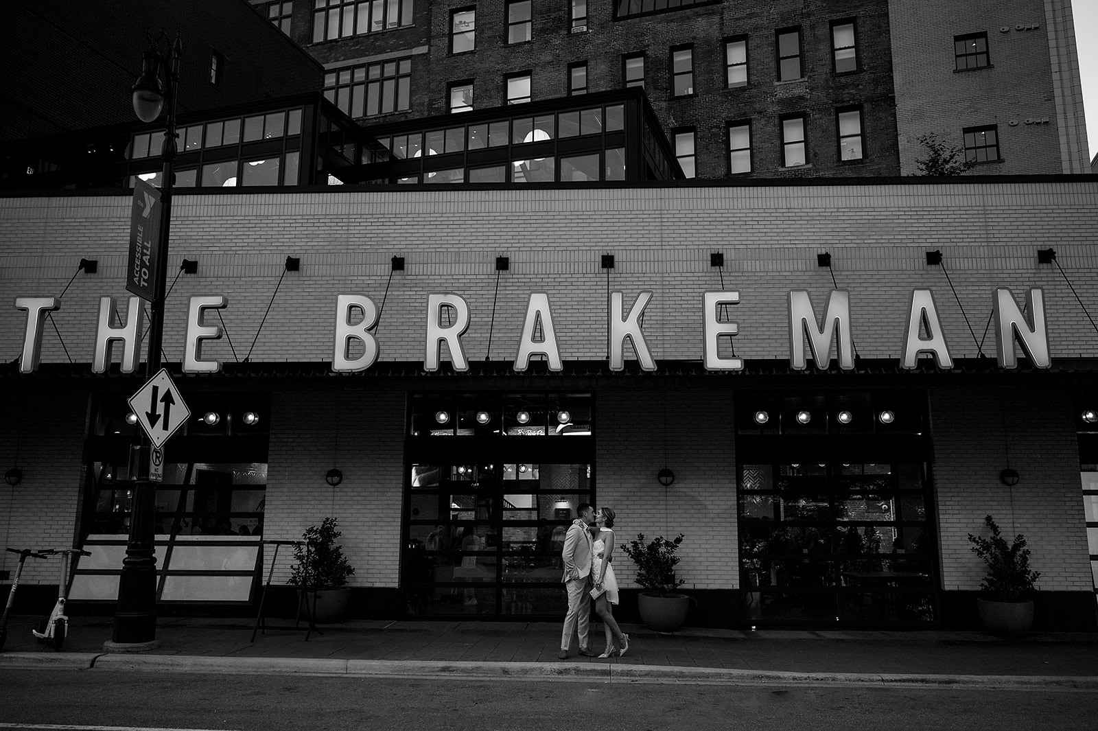 Bride and grooms Detroit wedding party photos in front of The Brakeman