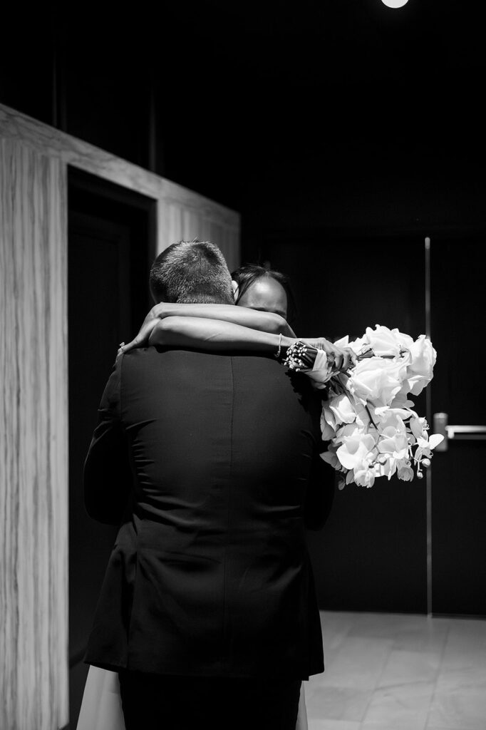 Bride and groom hugging after their ceremony