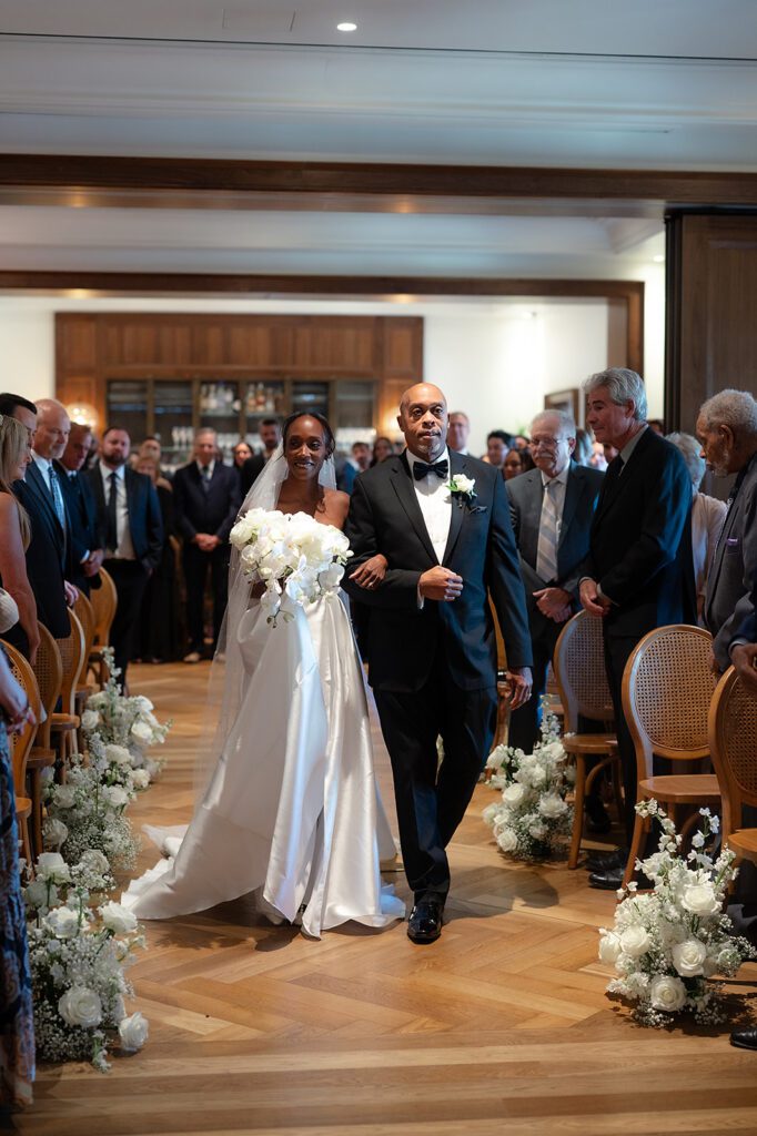 Bride walking down the aisle with her brother