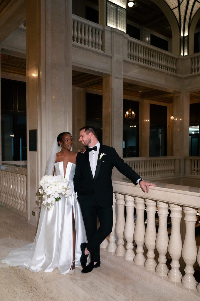 Bride and groom posing for their Book Tower wedding portraits