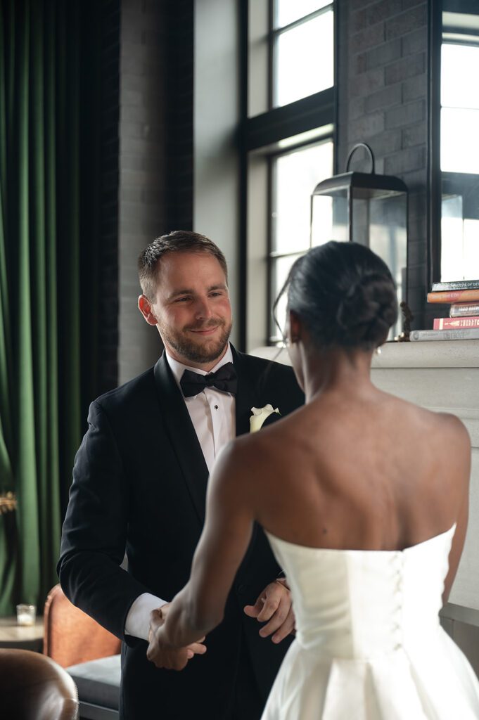 Bride and groom sharing a first look at Book Tower