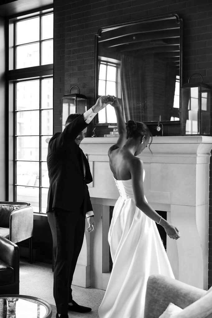 Groom tiwrling his bride during their first look