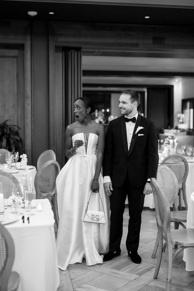 Bride and grooms wedding reception room reveal from a Book Tower wedding reception in The Conservatory