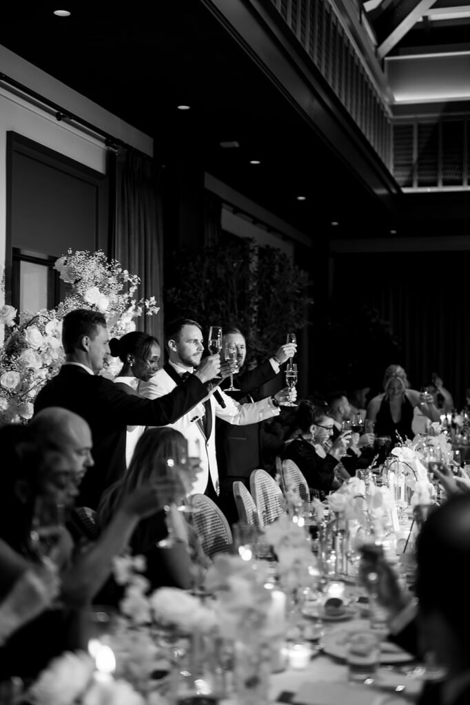Bride and groom toasting during speeches