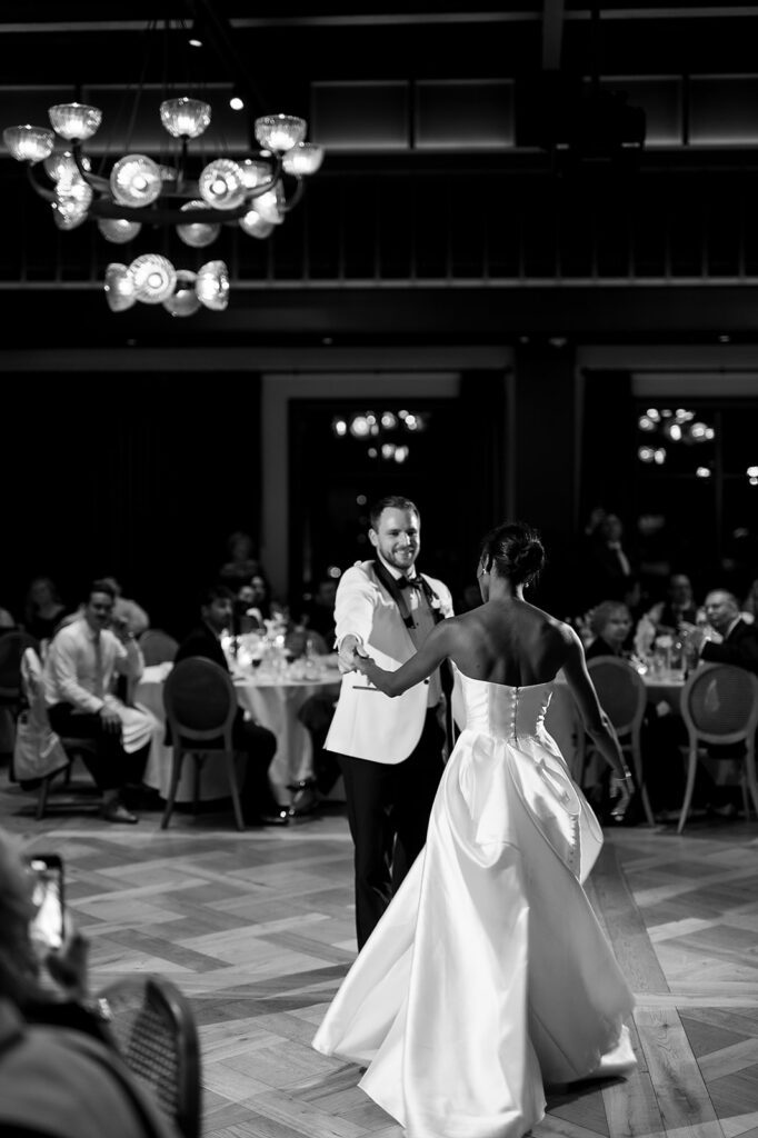 Bride and grooms first dance during their Book Tower wedding reception in The Conservatory
