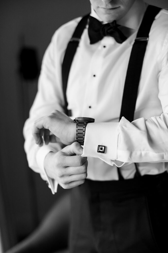 Detail shot of a groom getting ready