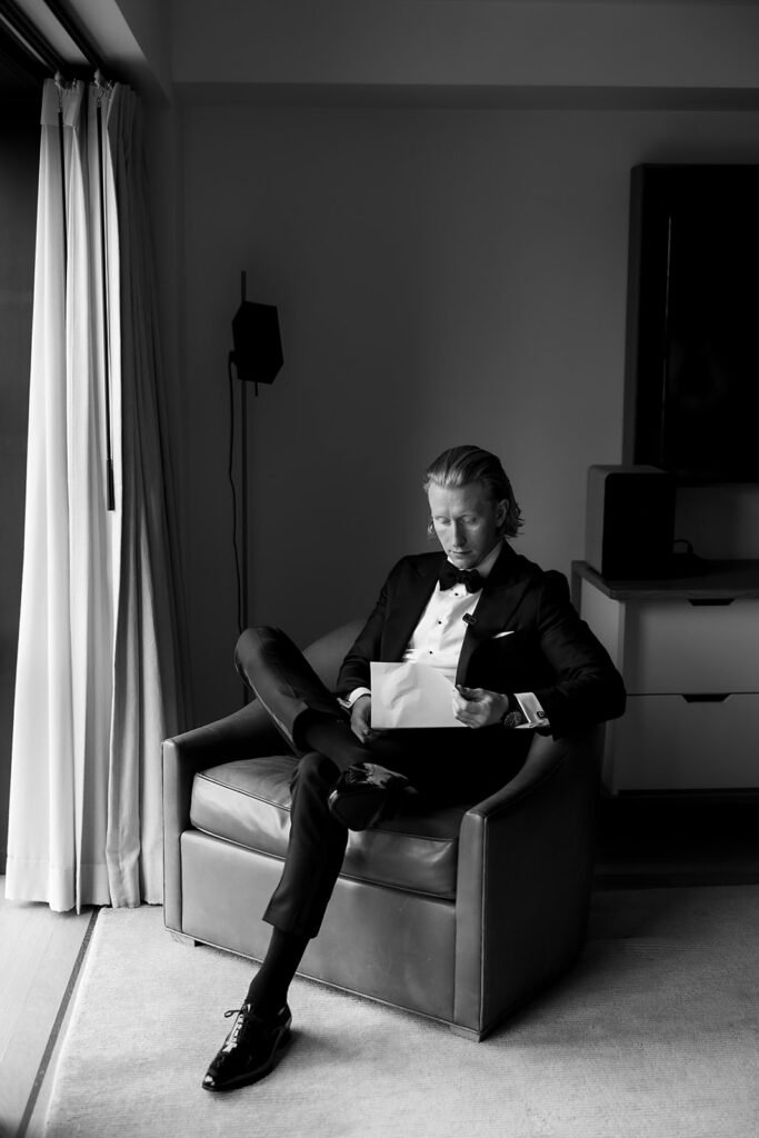 Groom reading a note from the bride