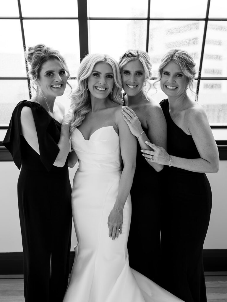 Bride and her sisters posing for portraits