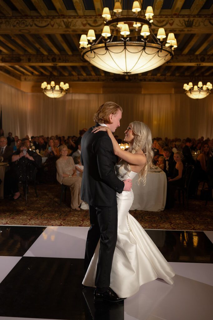Bride and grooms first dance during their Detroit Athletic Club wedding reception