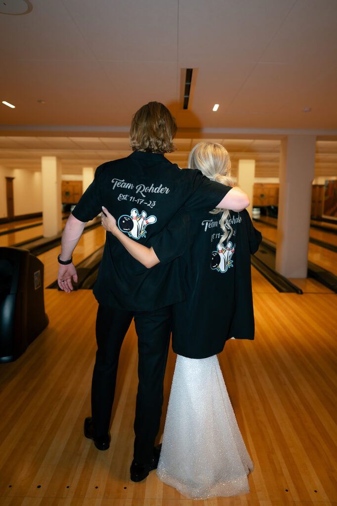 Bride and grooms custom bowling shirts during their Detroit Athletic Club wedding reception after party in the bowling alley