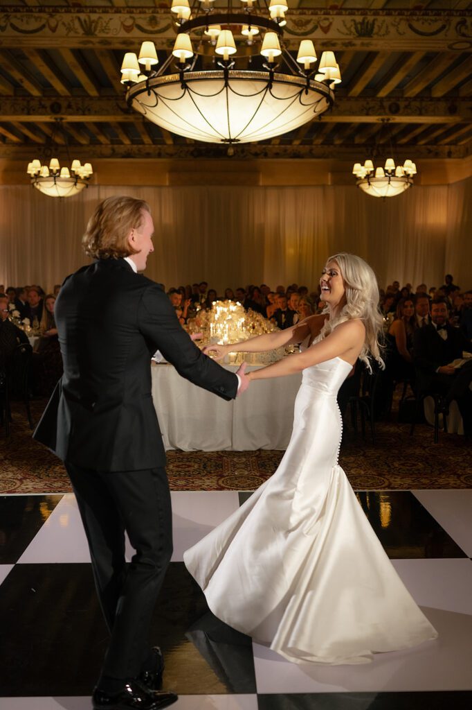 Bride and grooms first dance during their Detroit Athletic Club wedding reception