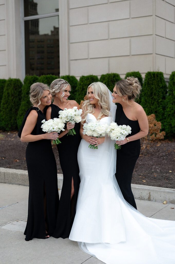 Bride and her bridesmaids posing for photos