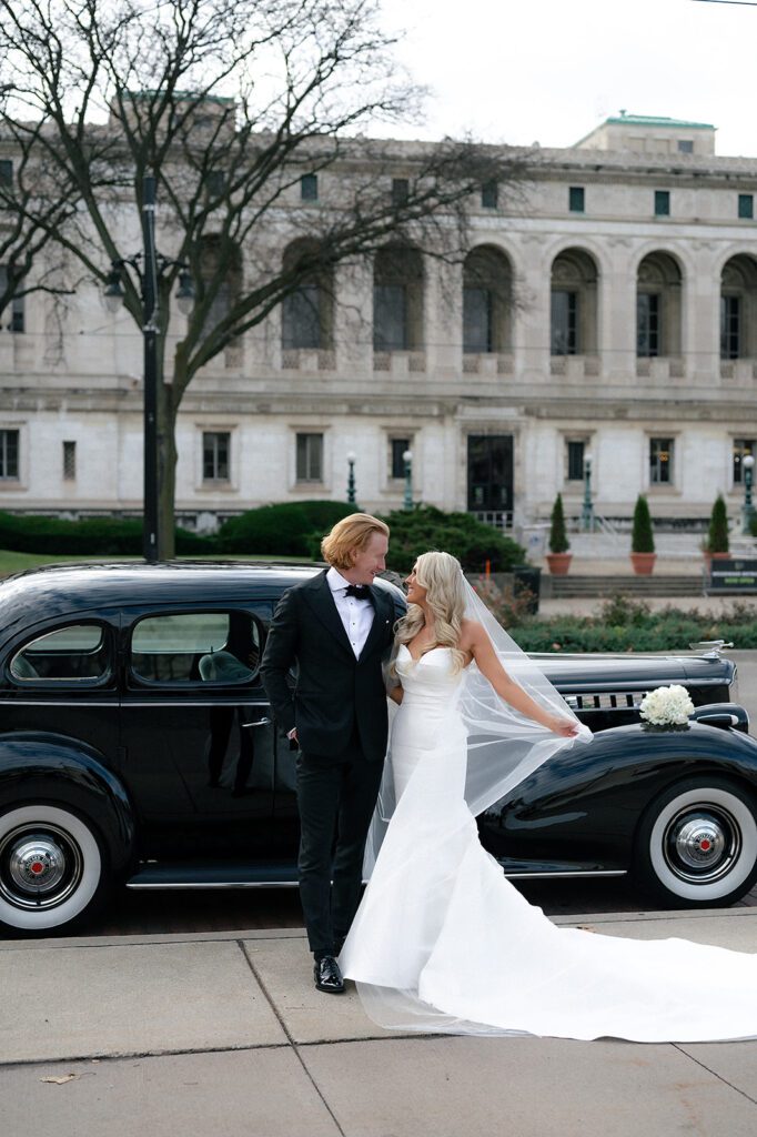 Bride and grooms Detroit wedding portraits with a 1940 Detroit Packard