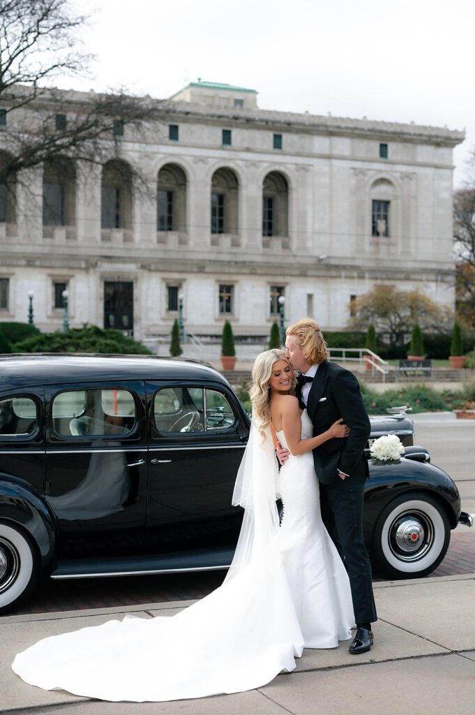 Bride and grooms Detroit wedding portraits with a 1940 Detroit Packard