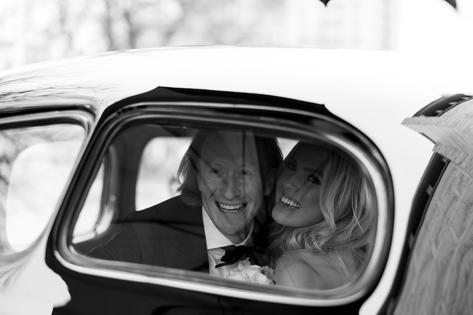 Bride and groom inside of a vintage car for their Detroit wedding portraits