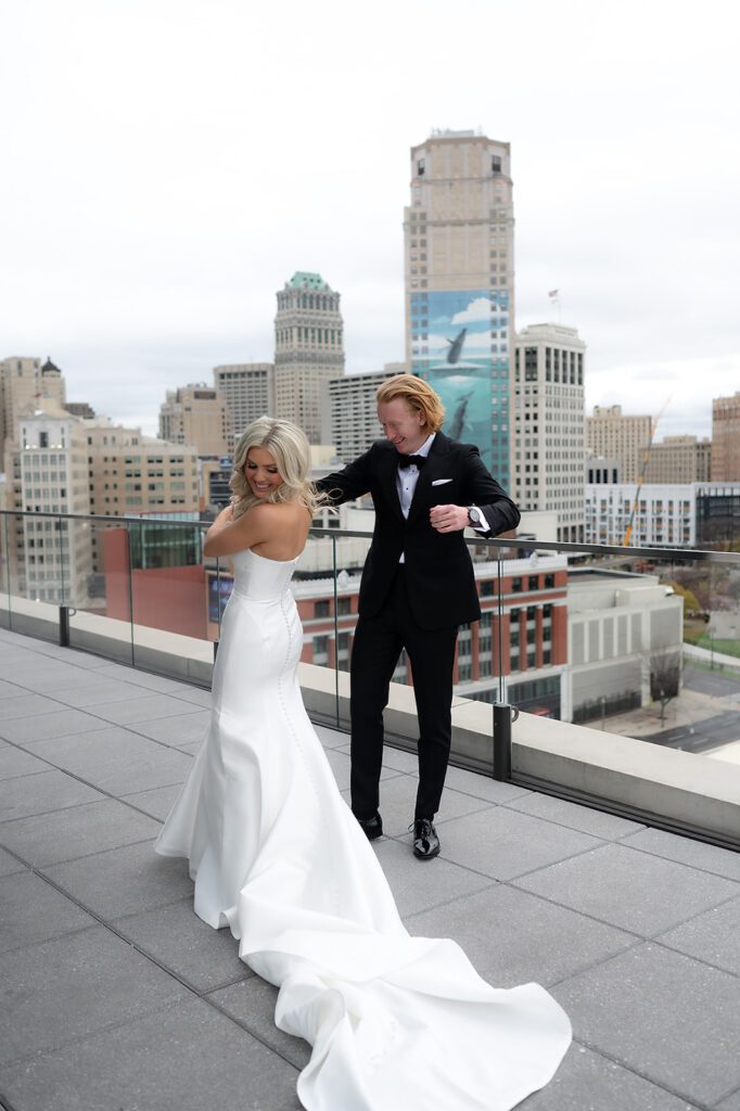 Bride and groom sharing a first look on the rooftop bar at Detroit Athletic Club
