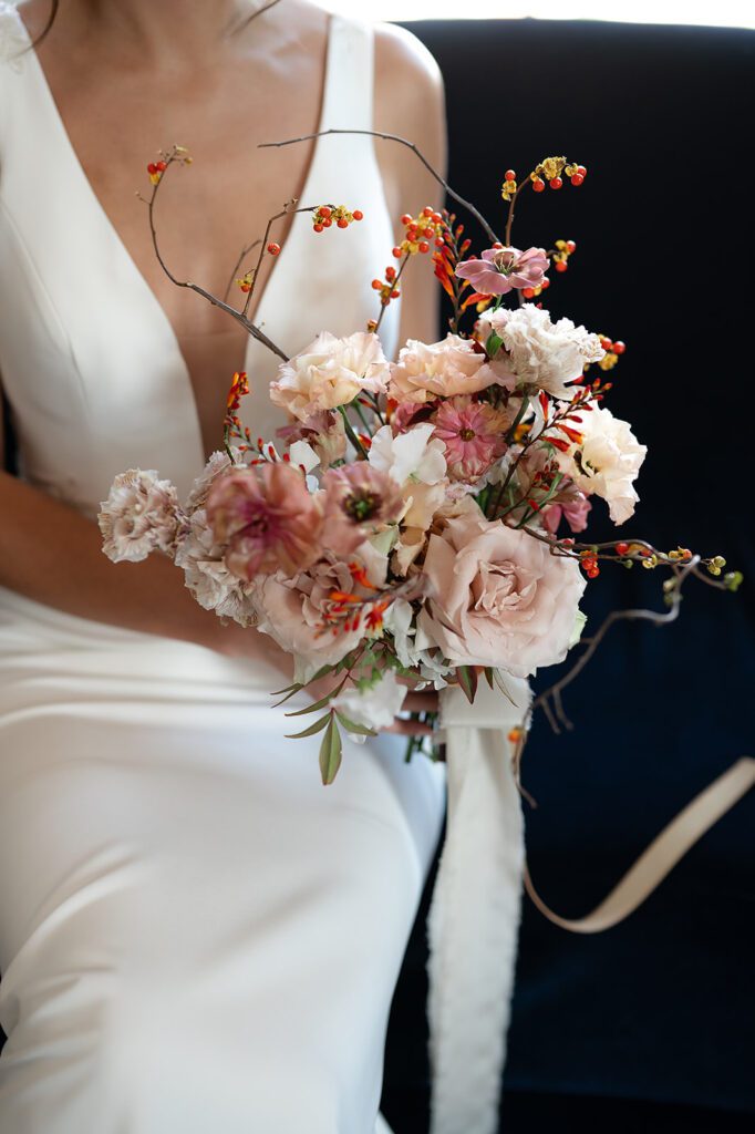 Bride holding her fall wedding bouquet