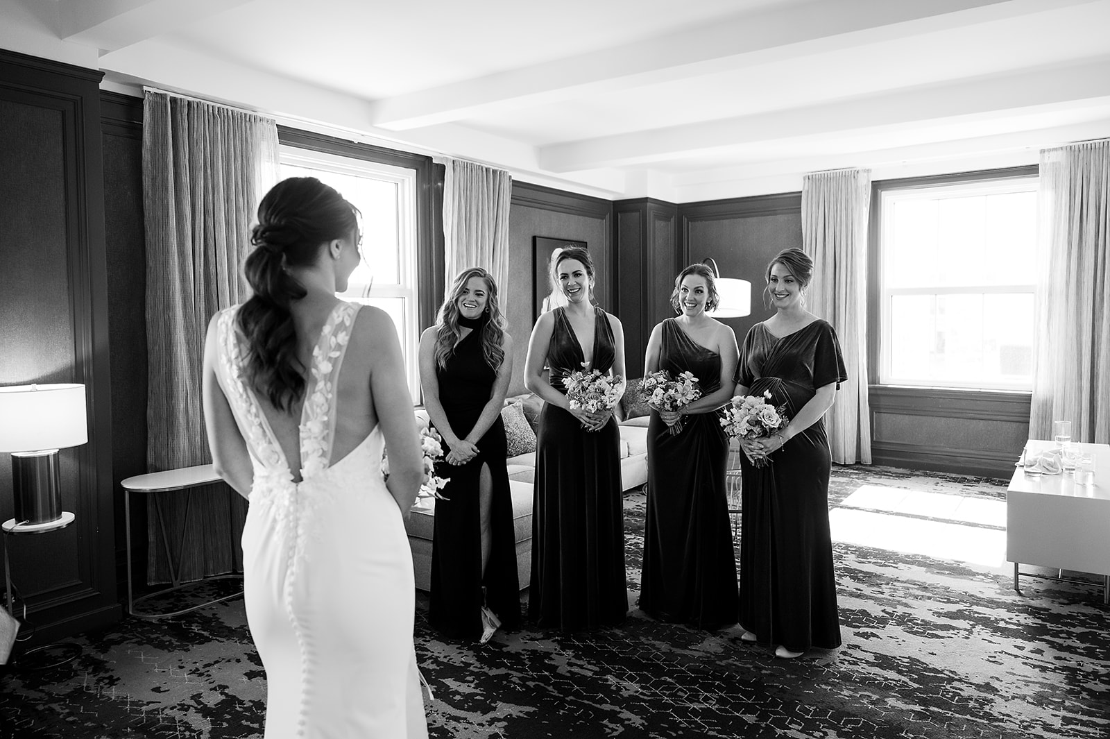 Bride and bridesmaids sharing a first look