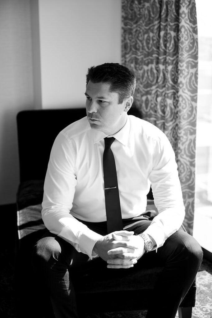 Indoor grooms portraits at Amway Grand Plaza in Grand Rapids, Michigan
