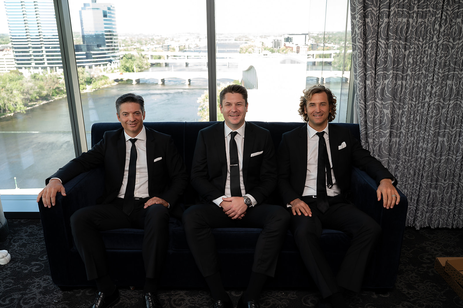 Indoor groom and groomsmen photo from a Amway Grand Plaza in Grand Rapids, Michigan