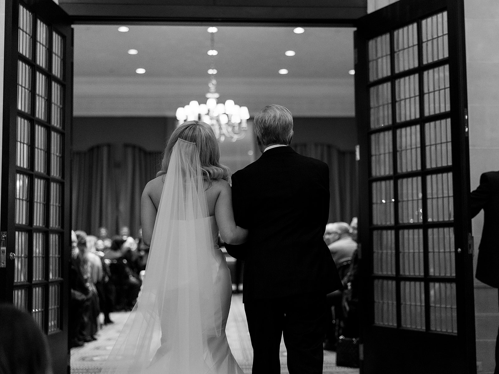 Bride being walked down the aisle by her father