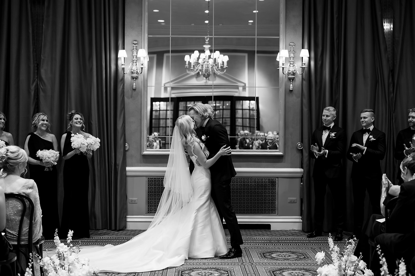 Bride and groom kissing during their Detroit Athletic Club wedding ceremony