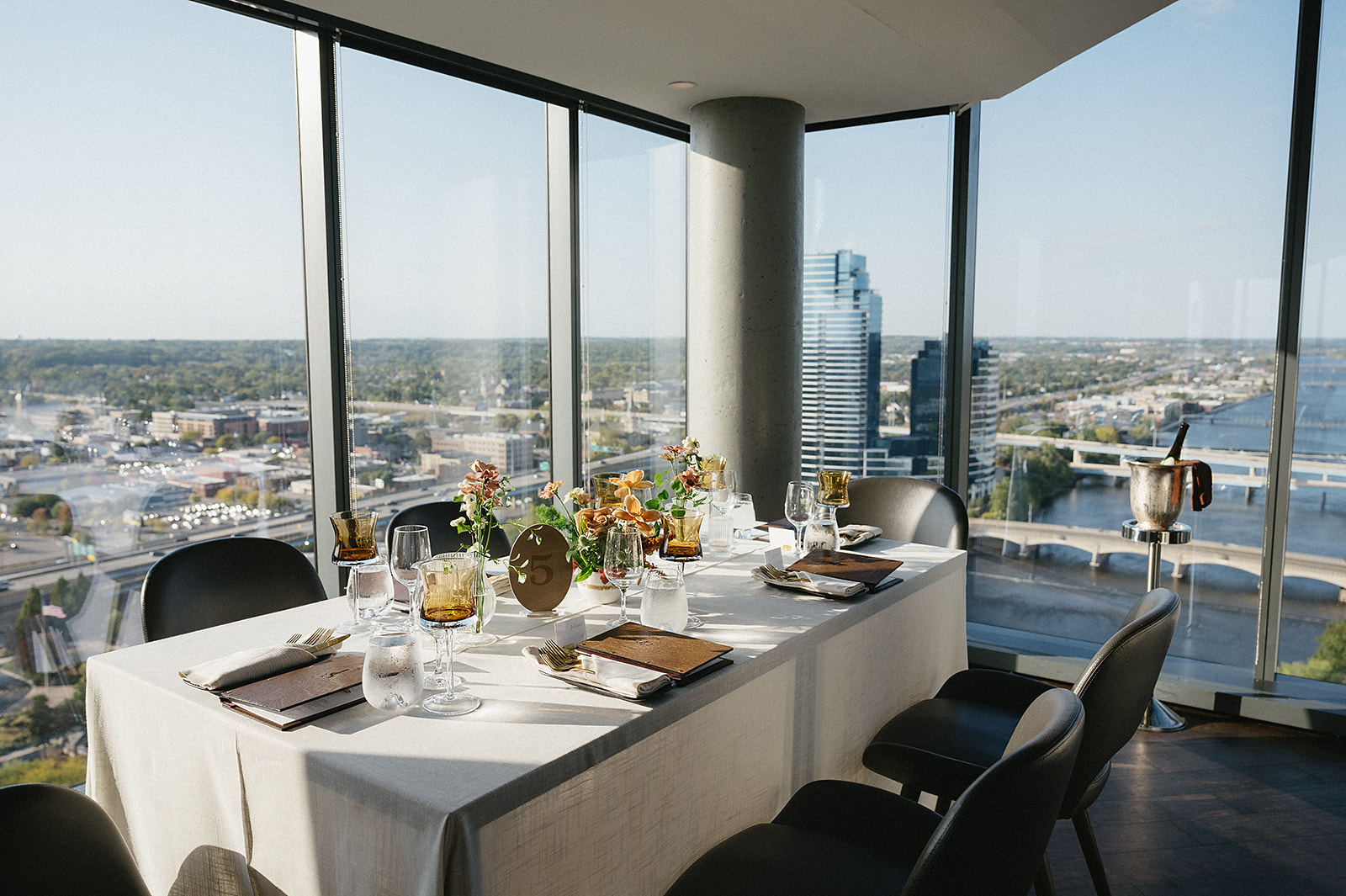 A panoramic city view surrounds an intimate dinner table setup during an MDRD Grand Plaza wedding reception.