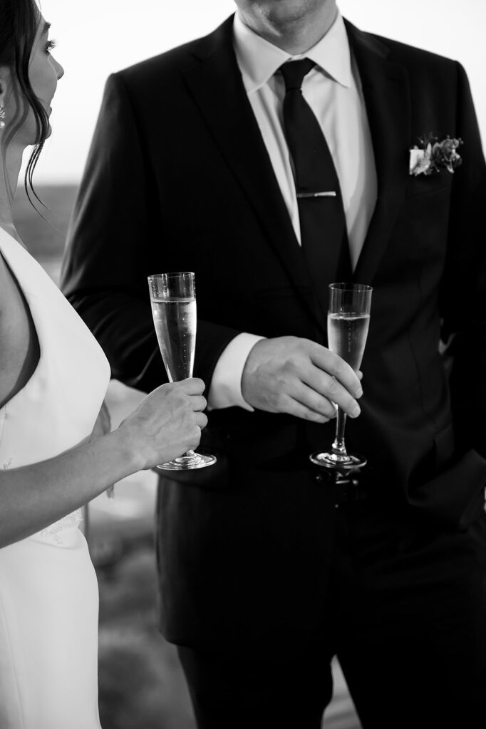 Bride and groom enjoying champagne during their Amway Grand Plaza wedding reception at MDRD