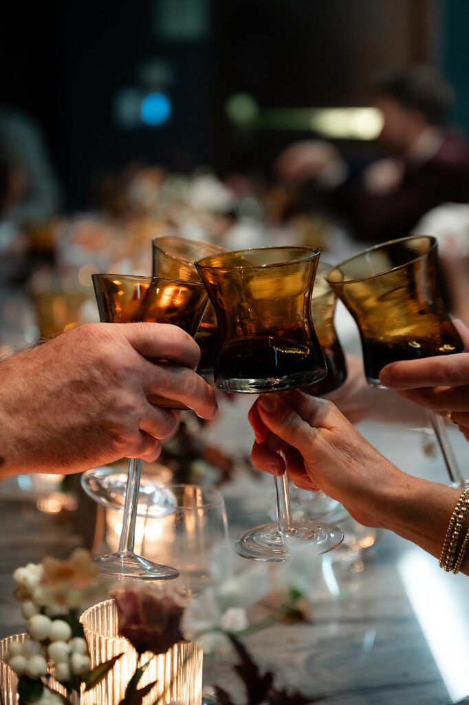 Wedding guests toasting glasses